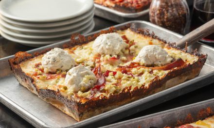 Delight in a cheesy, crispy masterpiece topped with savory goodness!